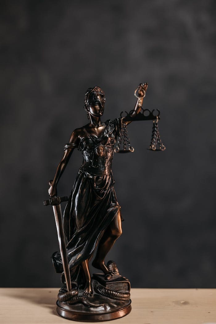 services-01 Elegant bronze Lady Justice statuette symbolizing law and justice.